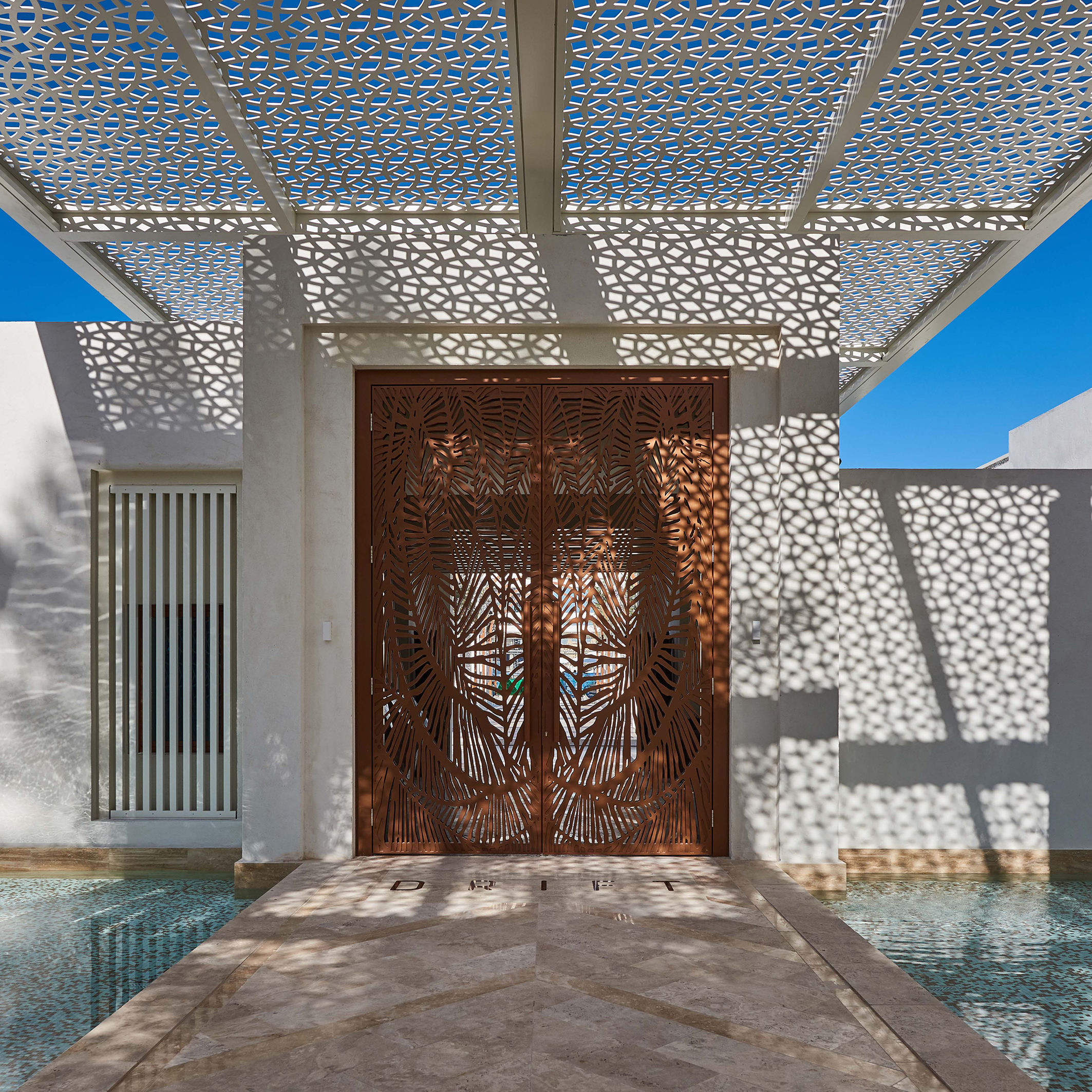 The entrance to the club. The project required careful co-ordination with the Interior Design, Landscape and specialist construction teams.