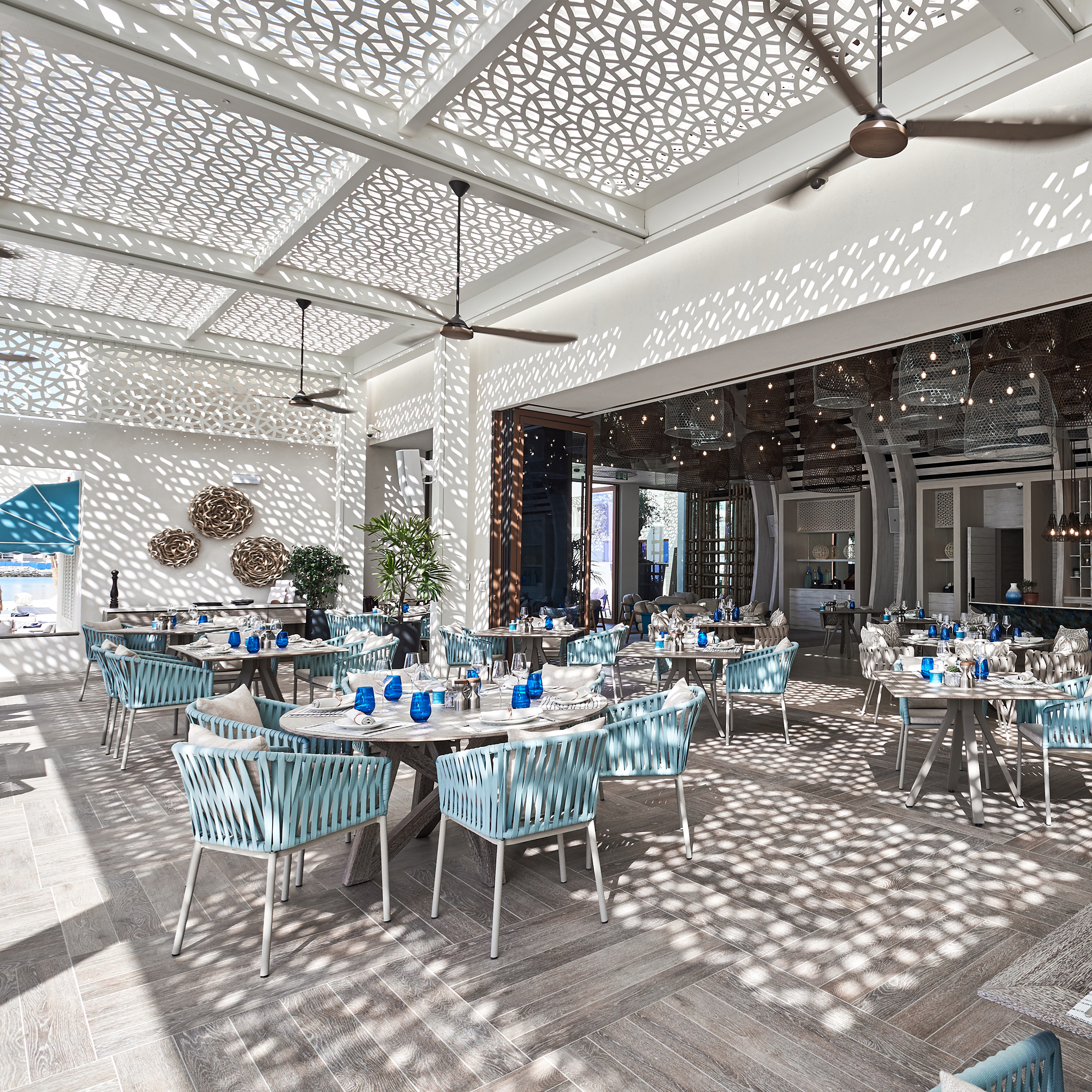 The restaurant has a full kitchen, and seats approximately 60 guests at tables and another 60 can be seated at round the bar. The main restaurant wall slides fully open.  The terrace roof also has retractable shading incorporated into the structure.